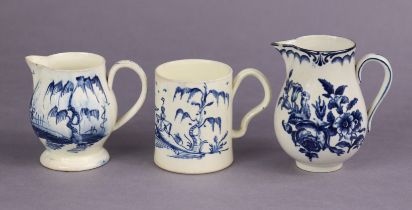 An 18th century English creamware small cylindrical mug with indented loop handle, painted in blue