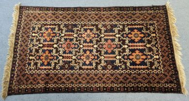 An Afghan Shirvan rug with repeating geometric design and multiple wide borders, 210cm x 120cm.