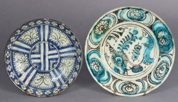 Two early Persian pottery dishes, probably Kashan circa 14th century, one glazed in turquoise with