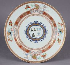 An 18th century Chinese export porcelain armorial charger, painted with a coat-of-arms in iron-