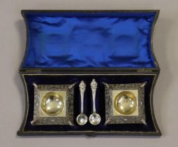 A pair of Victorian silver-plated square salt cellars with tapered sides having relief decoration,