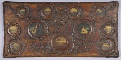 A late 18th/early 19th century Continental carved oak rectangular panel, inset eleven circular oil