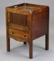 A late 18th century mahogany tray-top bedside commode, with single shelf enclosed by a tambor