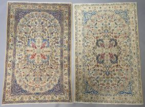 A pair of small Kashan rugs of pale blue & ivory ground, all over figured with floral motifs, 104c