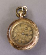 A late 19th/early 20th century continental ladies’ fob watch in engraved 14k case, the engraved gilt