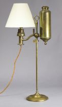 An Edwardian brass oil table lamp (converted to electricity) on adjustable column with circular
