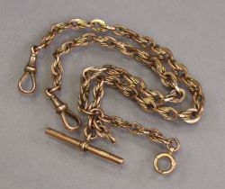 A 9ct gold albert of fancy oval links, with bar, a spring clip to either end, 34cm long (31.8g).