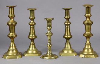 An 18th century brass candlestick, 20cm high; & two pairs of Victorian candlesticks, 26.5cm & 24.5cm