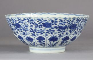 A Chinese blue & white porcelain moulded ‘lotus’ bowl, Kangxi period (1654-1722) painted with