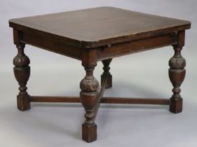 An early 20th century draw-leaf dining table