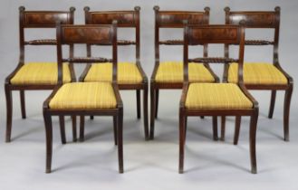 A set of six Regency mahogany dining chairs with rope-twist supports, padded drop-in seats