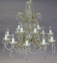 A 20th century glass 10-branch chandelier of two concentric tiers hung with cascading prism drops,