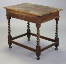 An early 20th century oak occasional table with moulded edge to the rectangular top, on barley-twist