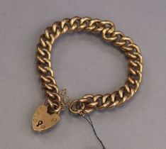 A 9ct. gold bracelet of hollow curb links, with padlock clasp & safety chain. (14.2 gm).