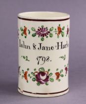 A documentary English creamware cylindrical tankard inscribed “John & Jane Harle, 1798” within a