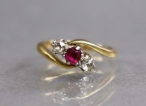 A gold cross-over design ring set round-cut ruby between two diamonds, hallmarks rubbed; size: F;