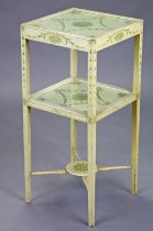 A George III-style cream-painted two-tier occasional table with ribbon and husk-swag decoration,