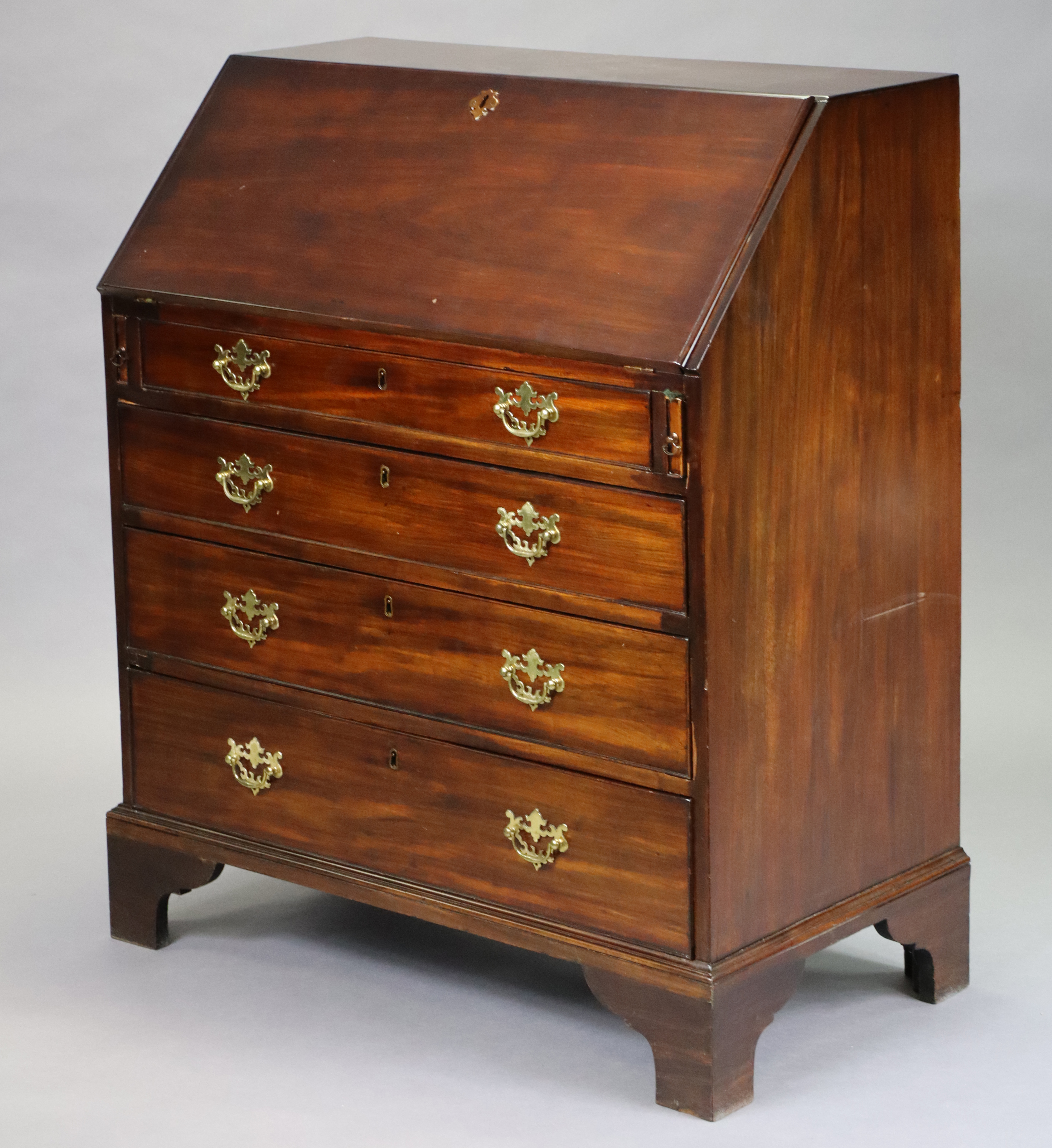 An 18th century mahogany bureau with fitted interior and gilt-tooled leather writing surface