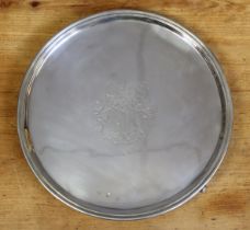 An Irish George III silver circular salver with moulded rim, engraved armorial to the centre, on