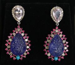 A PAIR OF MULTI-GEM DROP EARRINGS, each with pair-shaped carved tanzanite set within a border of