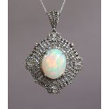 AN OPAL PENDANT, the large oval cabochon opal weighing approx. 5.2 carats, set within a wide open-