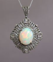 AN OPAL PENDANT, the large oval cabochon opal weighing approx. 5.2 carats, set within a wide open-