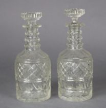 A pair of late 19th/early 20th century cut-glass decanters in the Regency style, 25cm high.