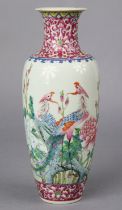 A Chinese famille rose porcelain slender ovoid vase painted with two Phoenix amongst peonies &