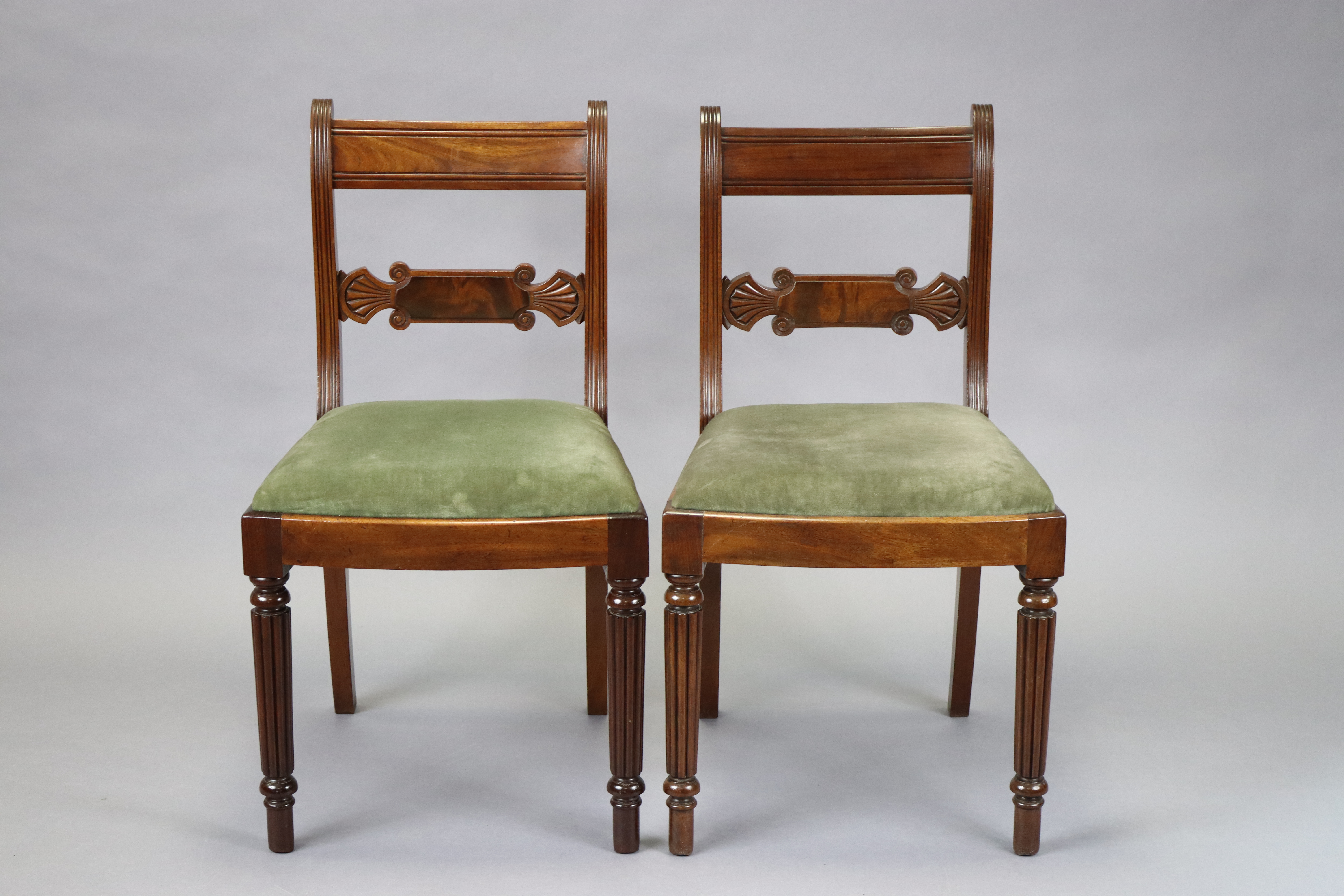 A pair of Victorian mahogany dining chairs with carved and shaped centre rails, reeded supports and - Image 2 of 3