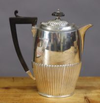 A George V silver oval semi-fluted hot water jug, 19.5cm high; Birmingham 1927 by Hollman &