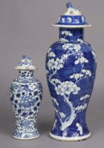 A 19th century Chinese blue & white porcelain prunus pattern baluster vase & cover, 35cm; & a