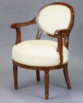 A late 19th century continental mahogany elbow chair with padded oval back and seat, scroll arms and