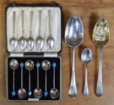 A set of six George V silver coffee spoons with blue “coffee bean” terminals, Birmingham 1935,