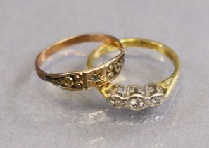 An 18ct gold ring set three tiny diamonds, size J (2.3g); and a yellow metal ring set single tiny