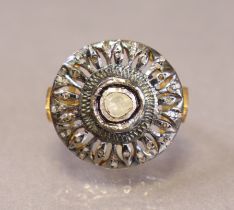 A dress ring with large circular head set mixed-cut graduated diamonds, size K/L (6.4g).