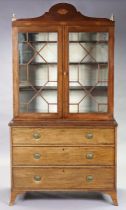 A Sheraton-style inlaid mahogany cabinet fitted three adjustable shelves enclosed by a pair of