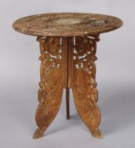 A late 19th/early 20th century Indian carved & bone-inlaid small circular occasional table, all-over