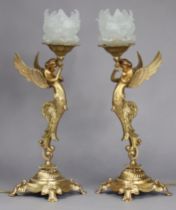 A pair of gilt-metal figural table lamps in the 19th century French style, each in the form of a