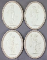 A set of four plaster bas-relief oval plaques depicting classical female figures emblematic of