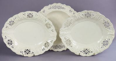 A pair of late 18th century English creamware oval dishes, the pierced borders with moulded husk