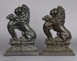 A pair of Victorian-style cast-iron rampant lion door porters, 38cm high x 25.5cm wide.