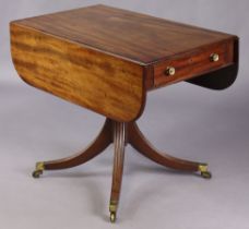 A Regency mahogany drop-leaf centre table fitted with a single drawer to one end & mock drawer to