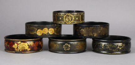 A group of six Regency lacquer wine coasters, 12cm to 14cm dia.