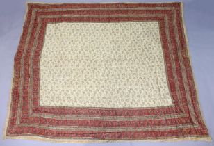A mid-20th century Indian padded quilt with printed boteh motif to the ivory field, in madder-ground