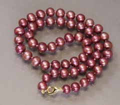 A cultured pearl necklace, the fifty-four pearls of near-uniform size, & of pink-ish/purple