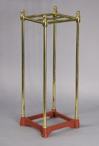 A late Victorian brass & cast-iron four-division umbrella stand, 59cm high x 20cm wide (lacking