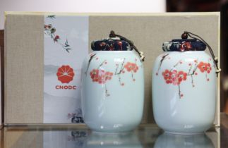 A pair of Chodc (Japanese) floral decorated porcelain tea caddy’s, 14cm high, cased.