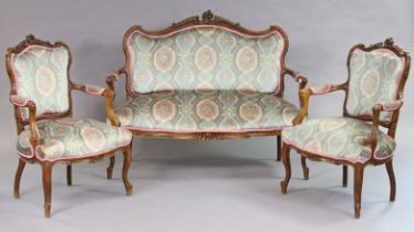 A Victorian carved beech frame three-piece lounge suite comprising of a two-seater settee