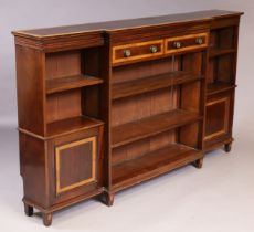 An Edwardian inlaid mahogany break-front open bookcase in the George III style, fitted two frieze
