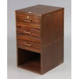 A mahogany dwarf standing office cabinet fitted three long graduated drawers above an open recess (